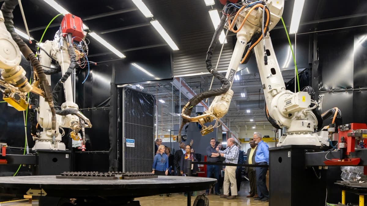 Industrial robotic arms on a modern manufacturing line