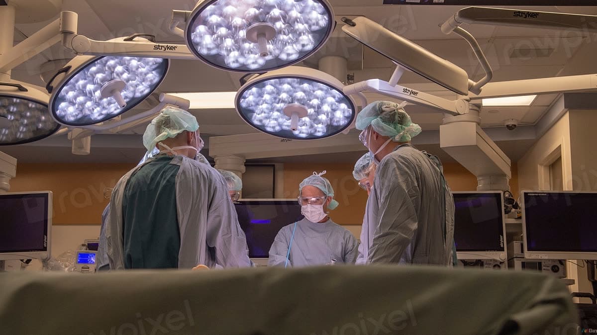 A clinical team working together in a hospital operating room