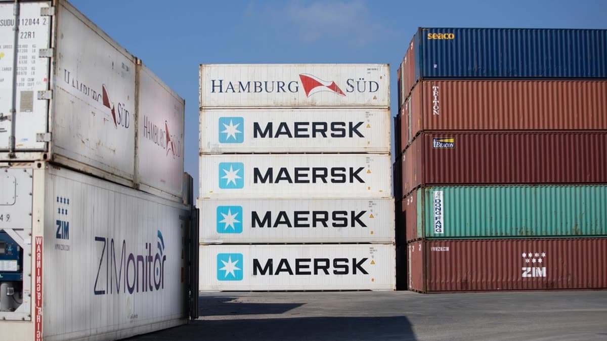 Stacked shipping containers at a logistics port